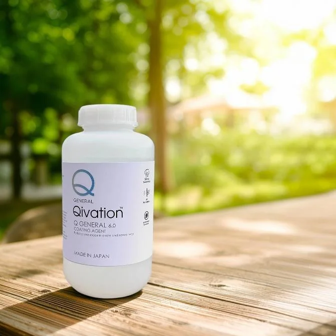 Qivation Q General 6.0 Coating Agent bottle on a wooden table in a garden